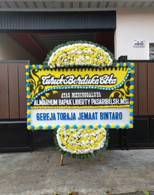 Papan Bunga Duka di Jamika